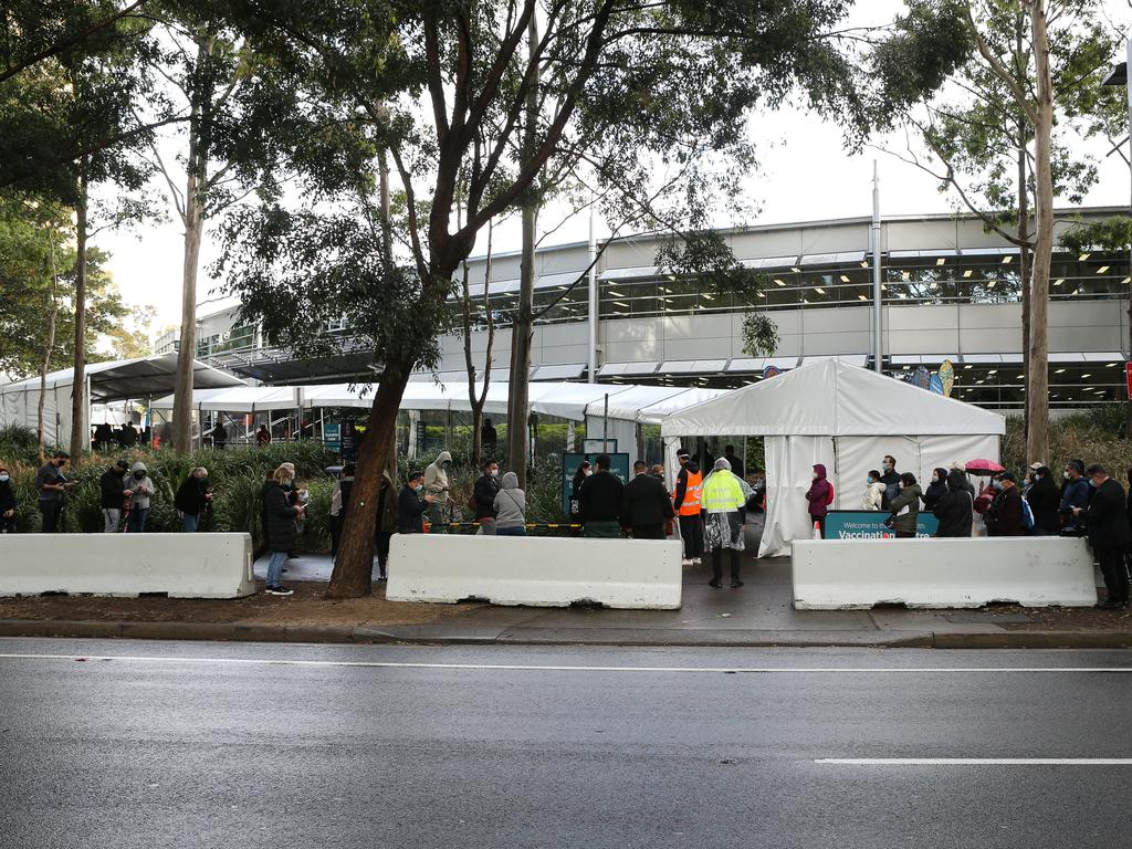 Long queues of people are seen lining up to get the Covid-19 vaccine at the Olympic Park Vaccination Hub in Sydney. Picture: Gaye Gerard