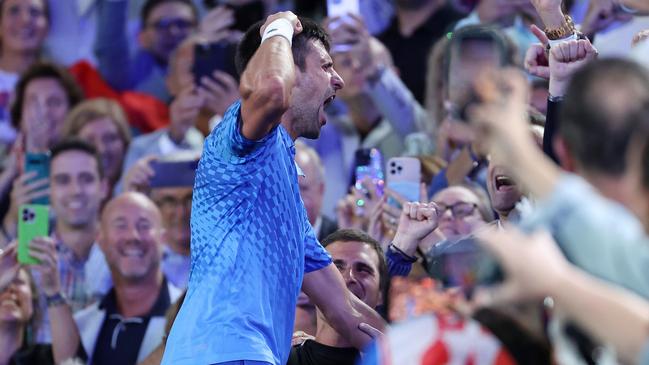 Novak Djokovic celebrates with his team after his win. Picture: Getty Images