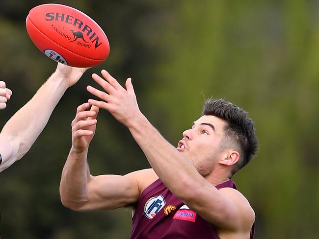 James Kroussoratis flies for a mark. Picture: Andy Brownbill