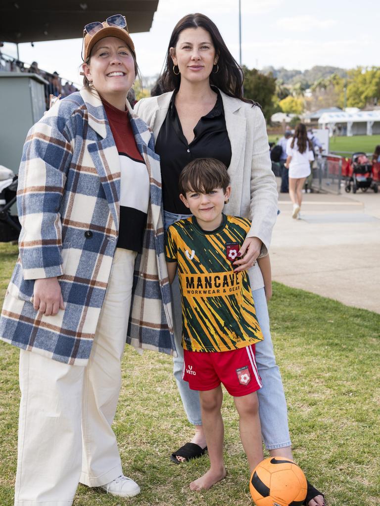 Amy Knights (left) and Emma Knights with Jax Brown supporting the St George Frillnecks . Picture: Kevin Farmer