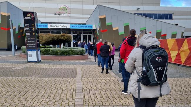 People see lining up to get their vaccination at the Wayville Showgrounds Vaccination Hub on Monday morning, July 11, 2022. Picture: Greg Barila