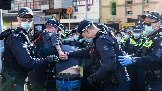 A man is arrested at the protest in Melbourne on Saturday. Picture: Sarah Matray / NCA NewsWire