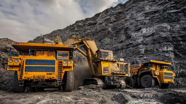 Coal production at one of the open fields in the south of Siberia. Dumpers "BelAZ". September 2015.