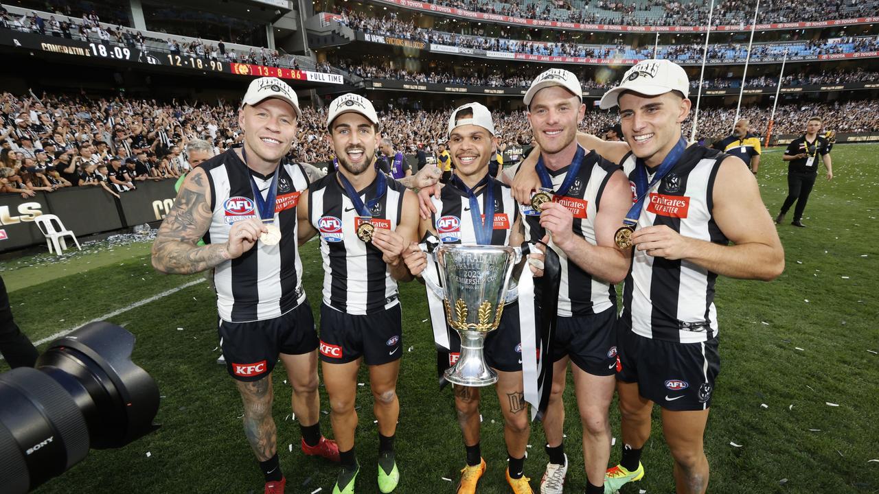 Jordan De Goey, Josh Daicos, Bobby Hill, Tom Mitchell and Nick Daicos of the Magpies celebrate. Photo by Darrian Traynor/AFL Photos/via Getty Images.