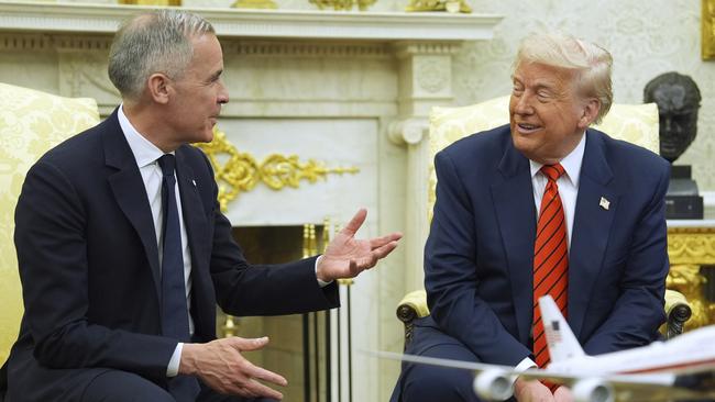 Canadian Prime Minister Mark Carney with Mr Trump in the Oval Office on Tuesday. Picture: AP