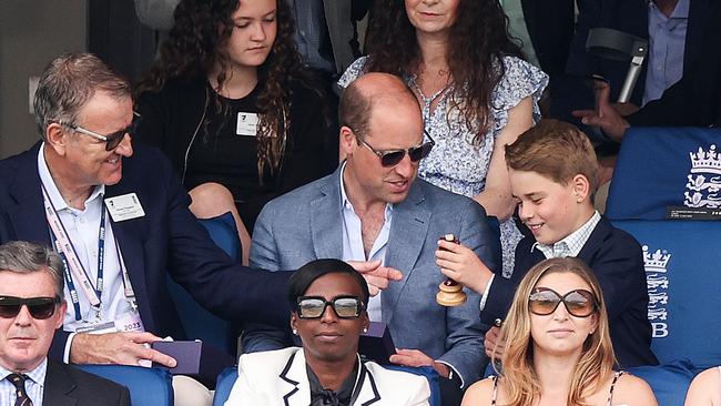 Prince William and Prince George hold a replica Ashes Urn while sitting next to Richard Thompson, Chairman of the ECB, during Day Four Ashes 2nd Test. (Photo by Ryan Pierse/Getty Images)