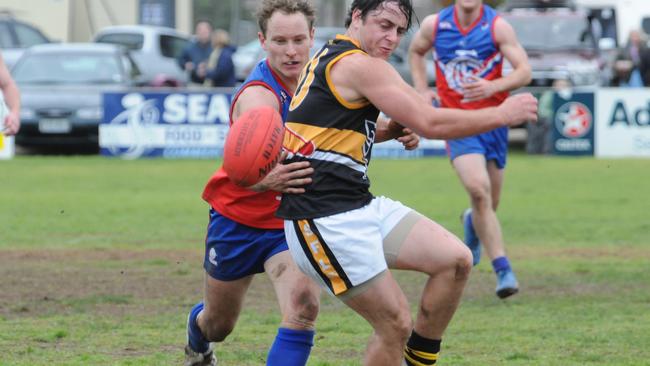 Brighton’s Todd Johnstone, a dominant player for the Bombers for many years and in the club’s 2011 premiership season, battles another former champ in Cove’s Josh Vick. Picture: Peter Worden