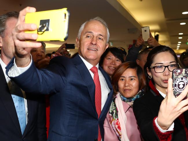 Prime Minister Malcolm Turnbull takes a selfie at Hurstville Station as he campaigns in the electorate of Barton on June 29, 2016 in Sydney, Australia. The Liberal Party given $40,000 in campaign funds to charity after the party inappropriately used Lucy Turnbull’s position as the head of a NSW Government planning body to promote two fundraisers in Sydney. Mrs Turnbull believed she had been invited as the Prime Minister’s wife. (Photo by Ryan Pierse/Getty Images)
