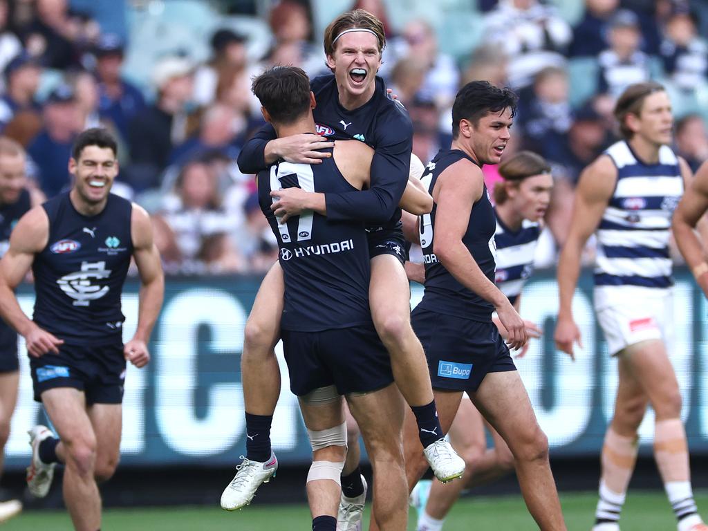 MELBOURNE, AUSTRALIA - APRIL 27: Jordan Boyd of the Blues is congratulated by team mates after kicking a goal during the round seven AFL match between Geelong Cats and Carlton Blues at Melbourne Cricket Ground, on April 27, 2024, in Melbourne, Australia. (Photo by Quinn Rooney/Getty Images)