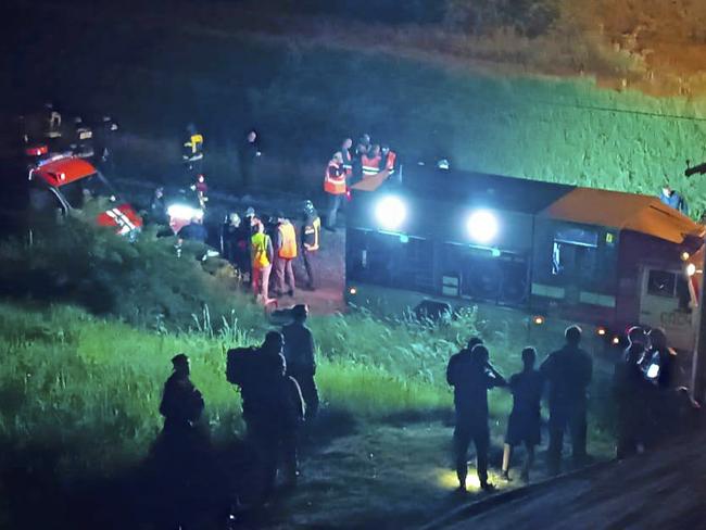 Emergency employees work at a damaged bridge in Russia's Bryansk region, which borders Ukraine. Picture: Moscow Interregional Transport Prosecutor's Office telegram channel via AP