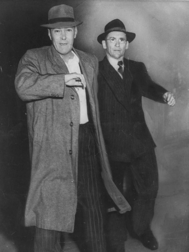 Gangster Hayes is restrained by detective Ray Kelly in 1951.