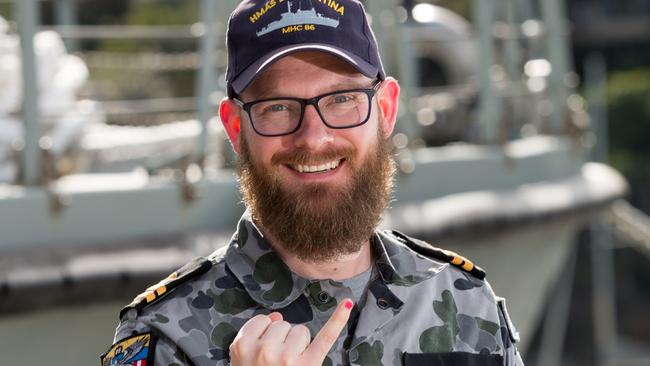 Royal Australian Navy officer, Lieutenant Maritime Warfare Officer Jonathan Milton, of minehunter coastal vessel HMAS Gascoyne, painted his pinky fingernail in support of gender equality campaign, 100 Days For Change. *** Local Caption *** Members of the Royal Australian Navy's Mine Warfare community undertook activities on 20 July 2018 in support of 100 Days For Change.  100 Days For Change runs between 1 July 2018 and 8 October 2018 and is a grassroots, action orientated initiative by Women & Leadership Australia to catalyse individuals and organisations into making achievable change to increase gender equity in their workplace.  Personnel painted their pinky fingernails pink as a visual indication of support for diversity in the workplace and positive cultural change at a bake sale hosted by, minehunter coastal crew, HMAS Huon, at Sydney base, HMAS Waterhen to support of 100 Days For Change.