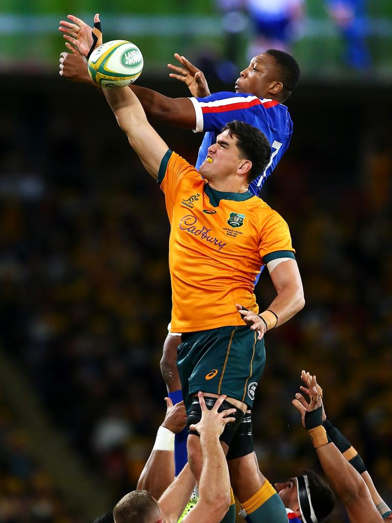 Wallabies lock Darcy Swain leaps high to win a lineout from France’s Cameron Woki. Picture: Jono Searle/Getty Images