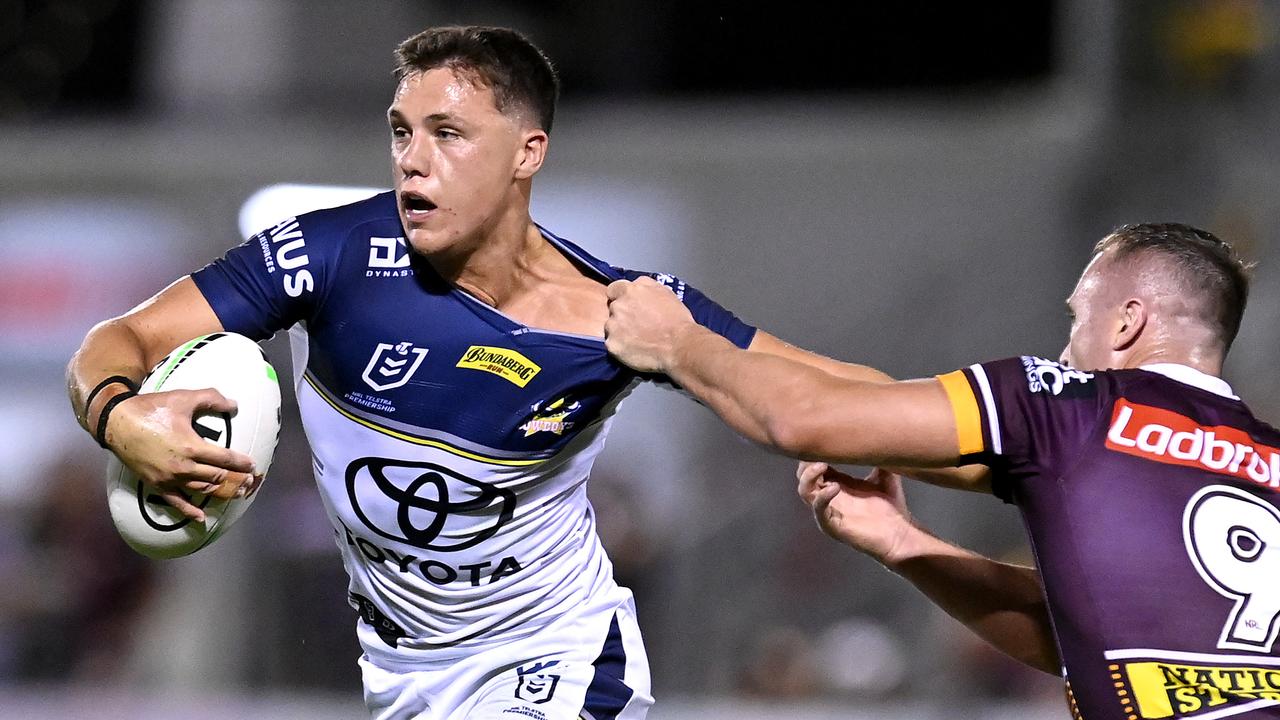 BRISBANE, AUSTRALIA - FEBRUARY 27: Scott Drinkwater of the Cowboys attempts to break away from the defence during the NRL Trial Match between the Brisbane Broncos and the North Queensland Cowboys at Moreton Daily Stadium on February 27, 2021 in Brisbane, Australia. (Photo by Bradley Kanaris/Getty Images)