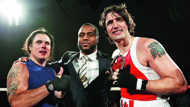 Justin Trudeau and Conservative Senator Patrick Brazeau pose after Trudeau defeated Brazeau during their charity boxing match in Ottawa, March 2012.