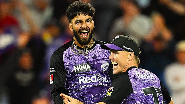 Nathan Ellis and Nikhil Chaudhary of the Hurricanes celebrate the win during the BBL Qualifier match between the Hobart Hurricanes and Sydney Sixers at Ninja Stadium on January 21, 2025 in Hobart, Australia. (Photo by Steve Bell/Getty Images)