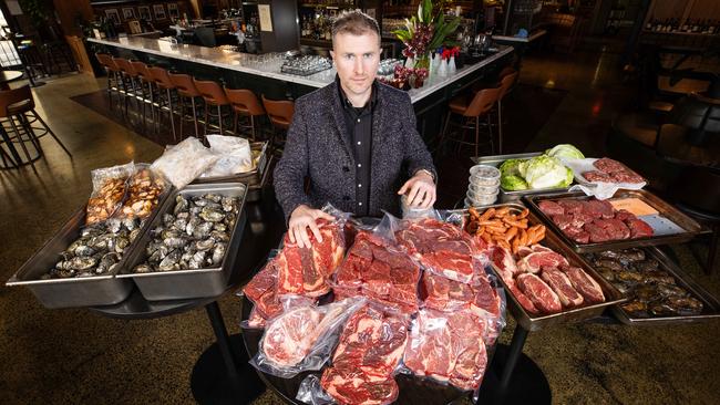 Angus &amp; Bon restaurant owner Liam Ganley with $25,000 worth of food that will go to waste during this weekend’s Covid-19 lockdown. Picture: Mark Stewart