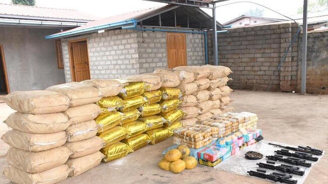 Weapons, ammunition, alongside bags of crystal methamphetamine and meth-laced yaba pills seized by Myanmar police and military. Picture: Reuters