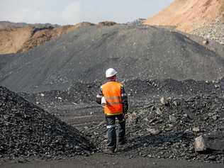 Coal mining in an open pit - Worker is looking on the huge open pit. Picture: agnormark