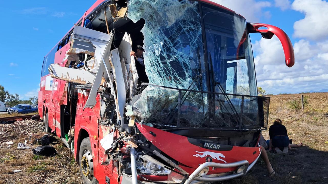 Supplied image from a passenger of a Greyhound bus and caravan crash near Gumlu. The bus driver looking out at the damage after the crash. The accident occurred on the worst-ranked stretch of the Bruce Highway. Picture: Supplied