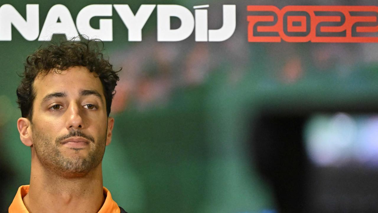 McLaren's Australian driver Daniel Ricciardo looks on during a joint press conference ahead of the 37th F1 Grand Prix of Hungary at the Hungaroring in Budapest on July 28, 2022. (Photo by Attila KISBENEDEK / AFP)