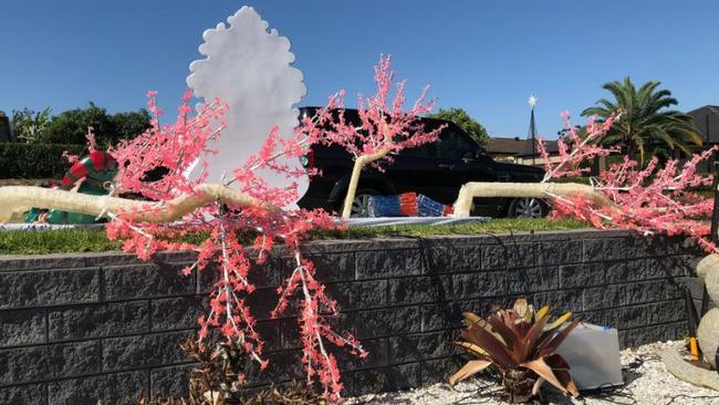 The cherry blossom Christmas lights at the Upper Coomera home after a flash storm and severe winds hit yesterday.