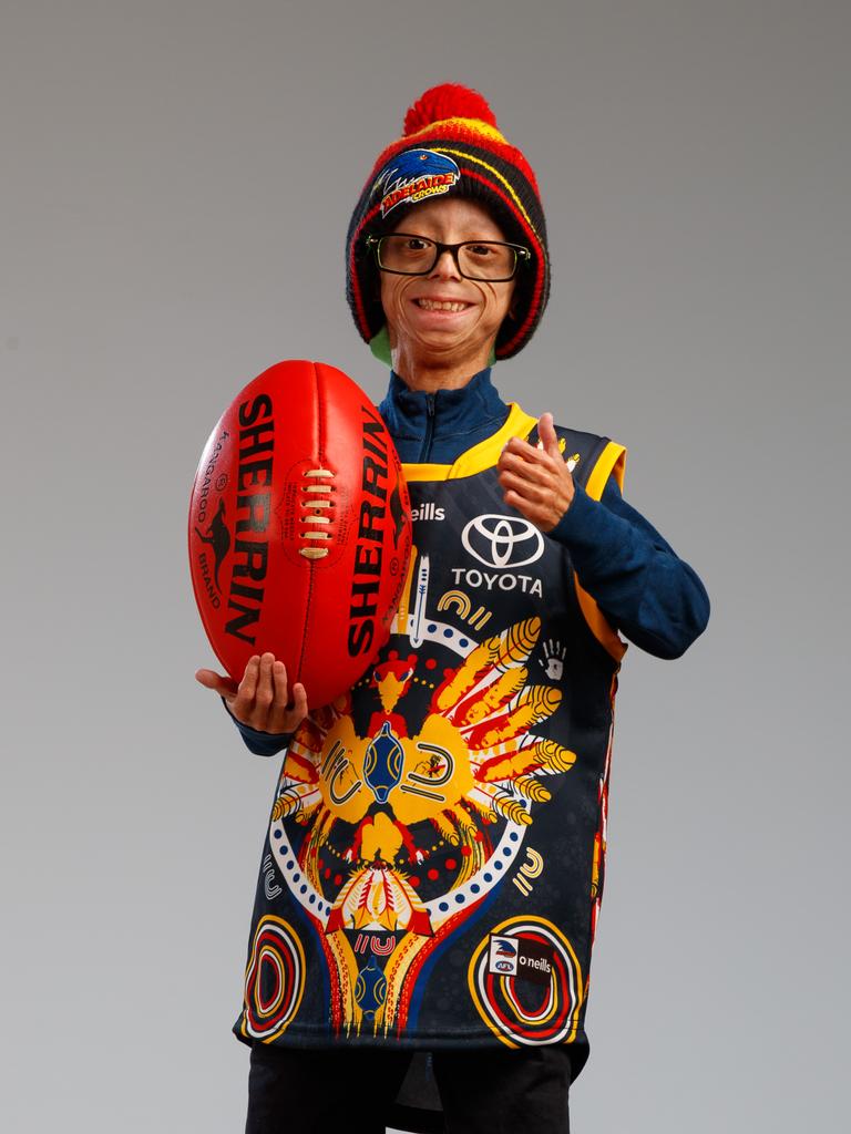 The little champion gives his footy club the thumbs up. Picture: Matt Turner