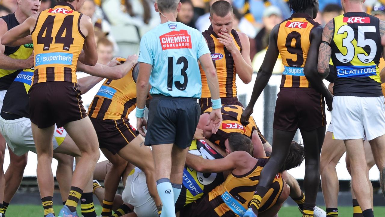 Tensions rise on the MCG as Hawks celebrate centenary