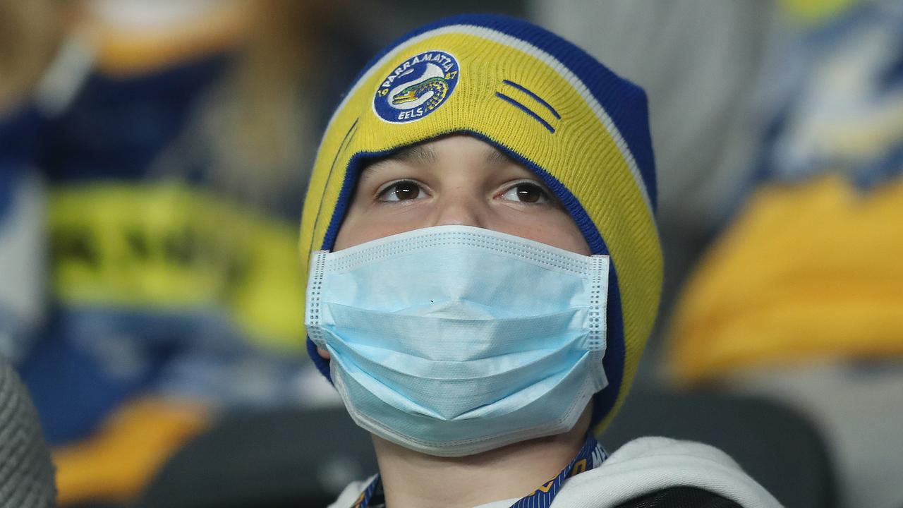 A Parramatta fan wears a mask during the round 8 NRL match between Parramatta and Cowboys at Bankwest Stadium. Picture: Brett Costello