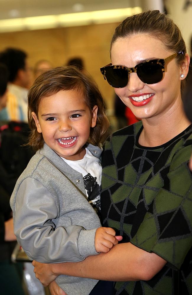 Supermodel Miranda Kerr, with a smiling son Flynn in her arms, arrives in Sydney from Los Angeles today. Picture: Ross Schultz