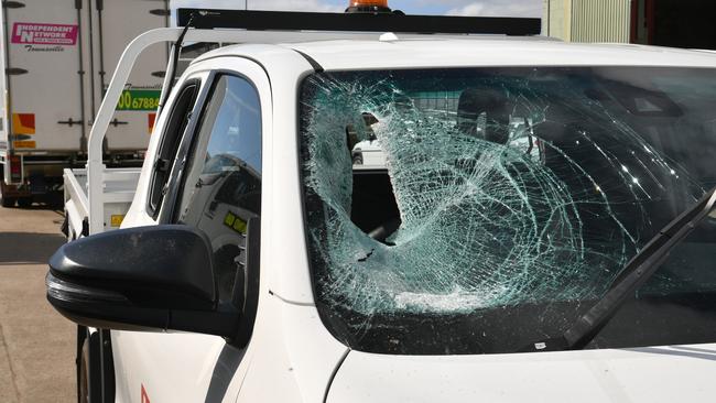 Debbie Thompson at Independent Network in Garbutt with vehicles damaged by a vandal. Picture: Evan Morgan