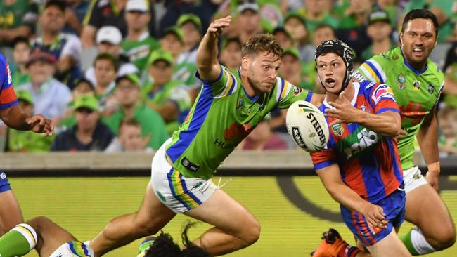 Kalyn Ponga gets a pass away for the Knights against the Raiders.