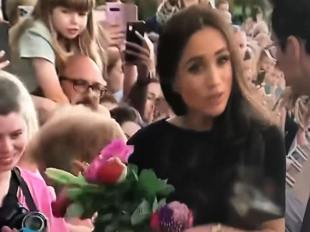 Meghan appeared annoyed when an aide approached her during the walkabout. Picture: Twitter