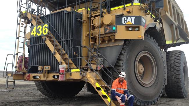 A Hunter Valley coal miner takes a break from building NSW. Mining jobs will be among those at risk no matter who wins the March election, one analysis says.