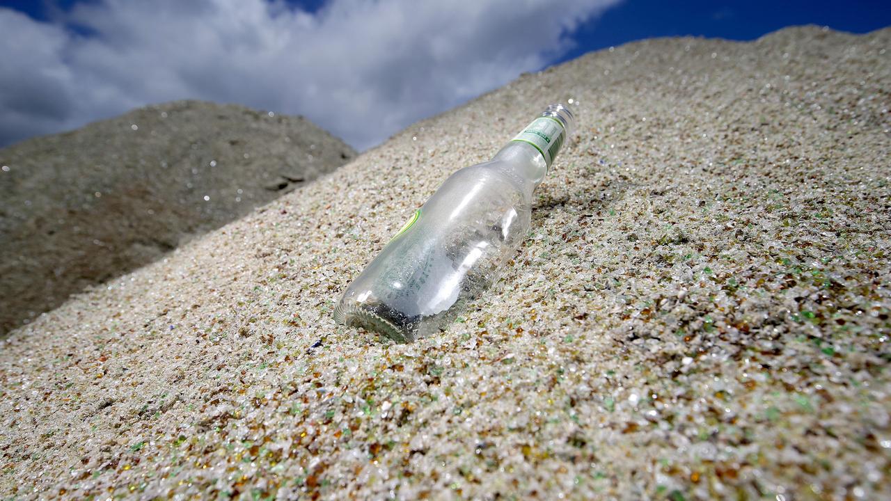 Kenick ConstructionsÕ Rachel Whymark received a load of ReGlass, a product created from recycled crushed glass at CouncilÕs MRF. This 30 tonne pile of glass is made from 176470 recycled bottles. The product is used as a substitute to sand at a Kenick Constructions residential development. Picture: Marc McCormack