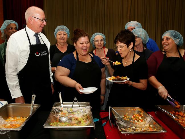 NSW Governor David Hurley and his wife Linda with volunteers at Parramatta Mission earlier this year.