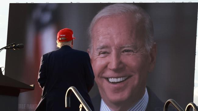 During a rally in Florida in 2022, Donald Trump watches a video of President Joe Biden. Picture: Getty Images.