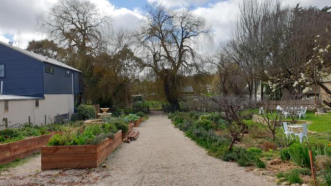 The communal garden used by Seasonal Garden Cafe for weddings and functions. Light poles were cut down and plants removed without approval of the landlord. Picture: Renato Castello