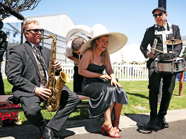 Racegoer Kat Robertson got a personalised performance from the brass band at the track. Picture: Sam Ruttyn