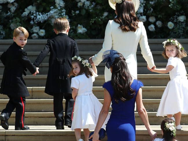 Prince George looks over his shoulder at the cameras. Picture: AFP PHOTO / POOL / Jane Barlow