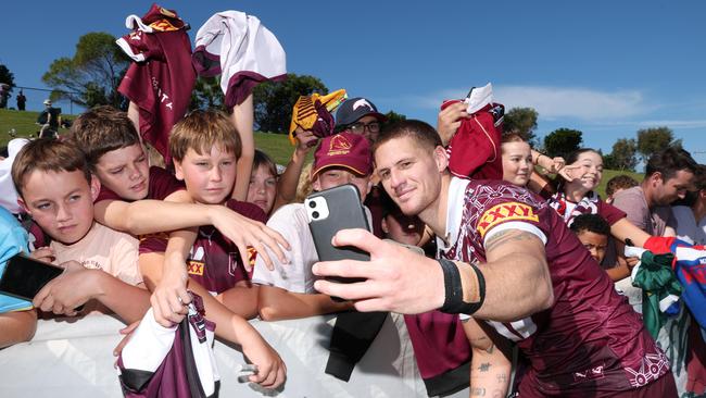 Kalyn Ponga takes a selfie with Queensland fans at the Maroons open training day. Picture Lachie Millard