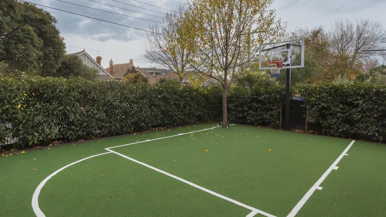 A basketball court covered in turf.