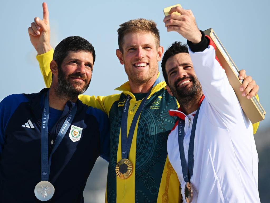 Silver medallist Pavlos Kontides of Team Cyprus, gold medallist Matt Wearn of Team Australia and bronze medallist Stefano Peschiera of Team Peru pose for a podium selfie. Picture: Clive Mason/Getty Images