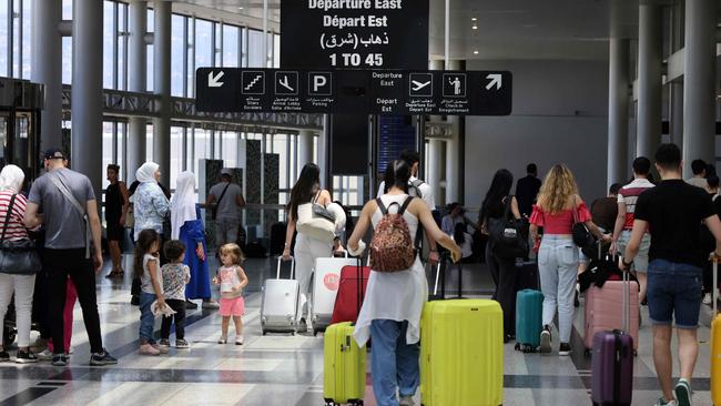 Passengers depart Rafic Hariri International Airport in Beirut amid soaring tensions. Picture: AFP.