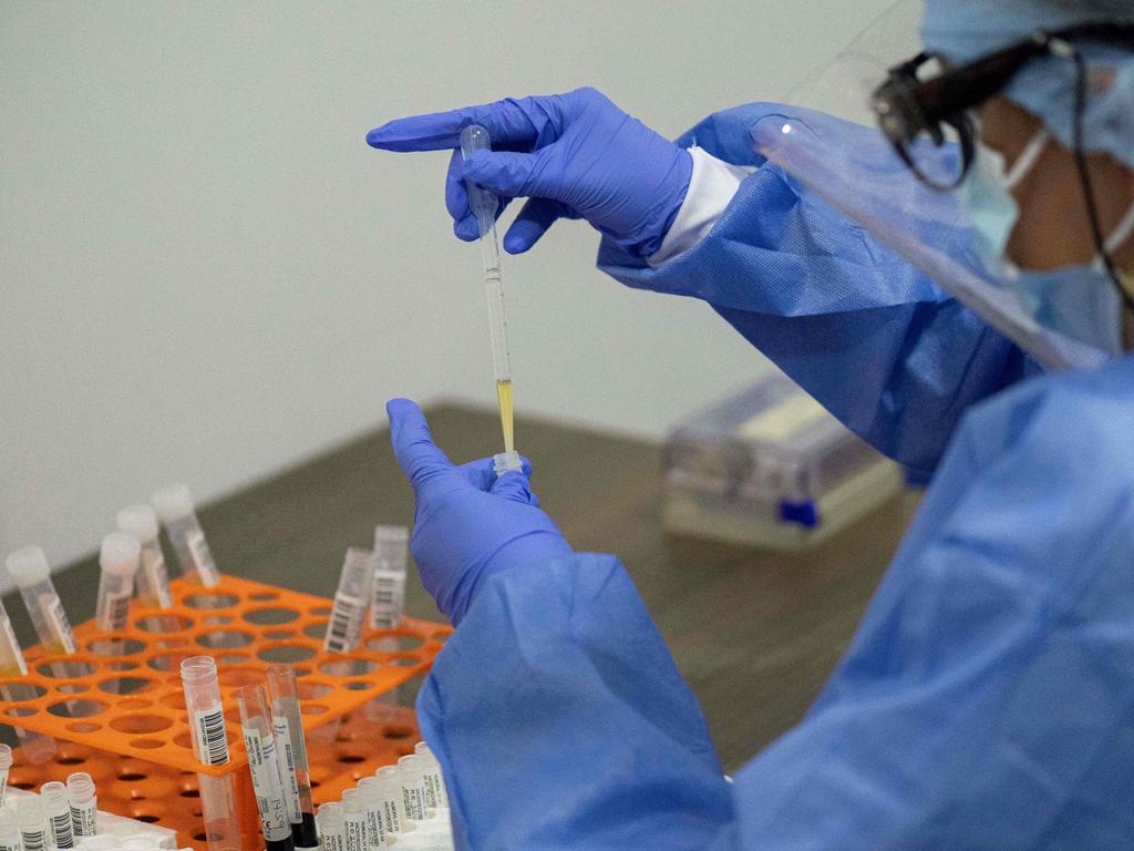 A health worker sorts blood samples for a phase 3 COVID-19 vaccination study at the Center for Pediatrics Infectology Studies (CEIP) for the pharmaceutical company Janssen, of Johnson &amp; Johnson. Picture: Luis Robayo / AFP