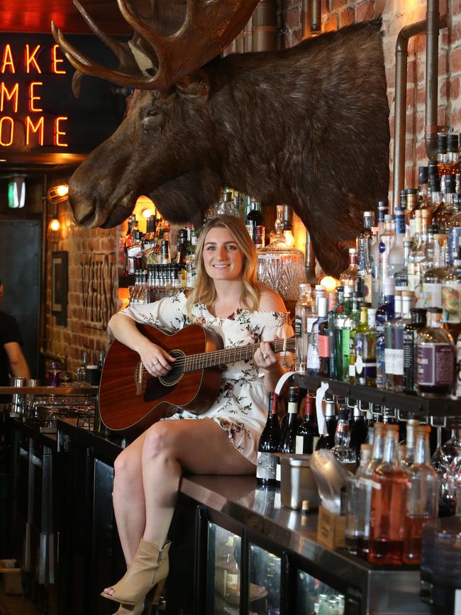 Brooke Lambert is a local artist who will be performing at Groundwater Country Music Festival at Broadbeach. Brooke and her guitar at The Loose Moose at Broadbeach. Picture Glenn Hampson