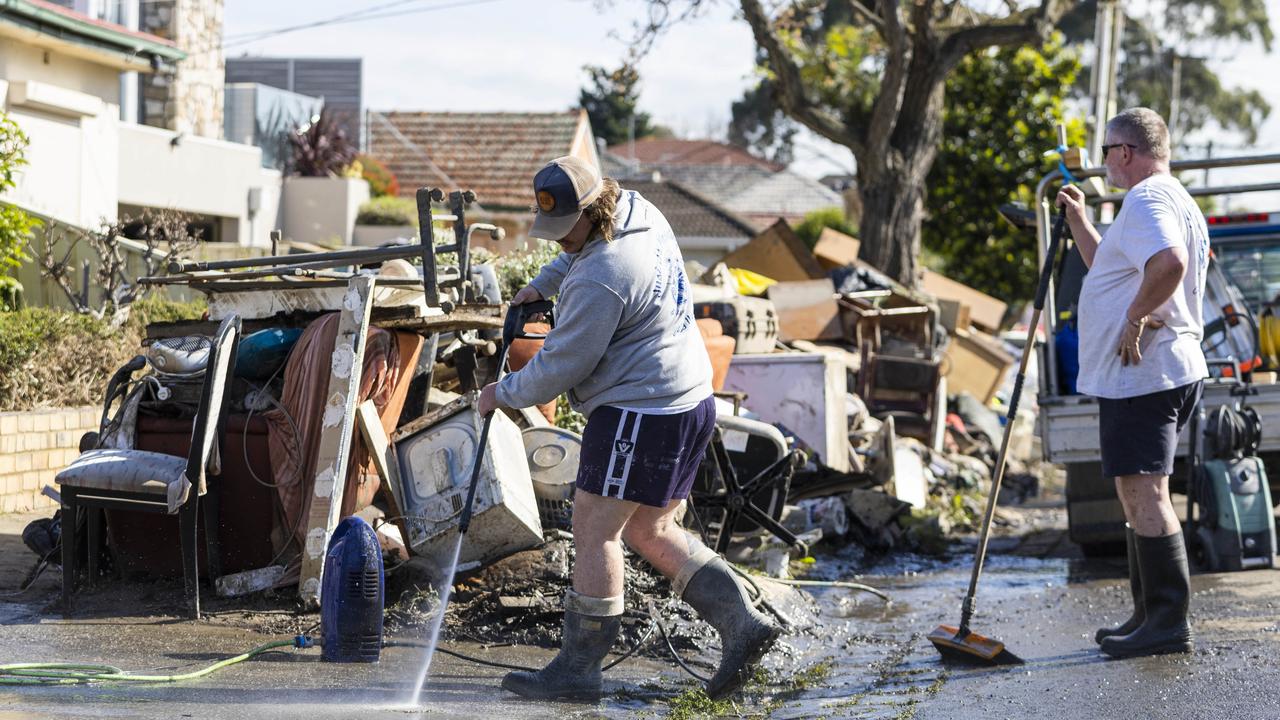 Residents of Clyde St in Maribyrnong begin the clean-up. Picture: NCA NewsWire / Aaron Francis