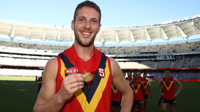  Michael Knoll poses with the Fos-Williams medal for best SANFL player during the state game between WA and SA at Optus Stadium on Sunday. Picture: Paul Kane/Getty Images