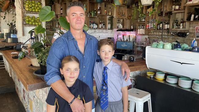 Business owner Brenton McHatton with his children Dylan, 8 and Taro, 11.