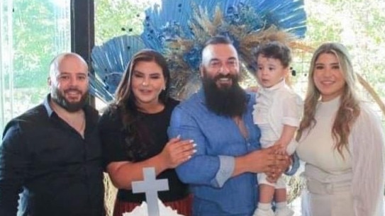 Bob Chahine and Ghosn Ghosn with their wives Remonda (left) and Sarah (right) and their children.